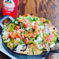 Cheese Nachos · Crispy tortilla chips topped with tomatoes, black beans, jalapenos, melted Mozzarella cheese...