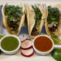 Taco Platter · Tacos Authentic or el gringo, rice and black beans. Choice of meat.