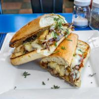 Steak Sandwich · Caramelized onions, melted mozzarella cheese, sauteed peppers and chipotle mayonnaise.