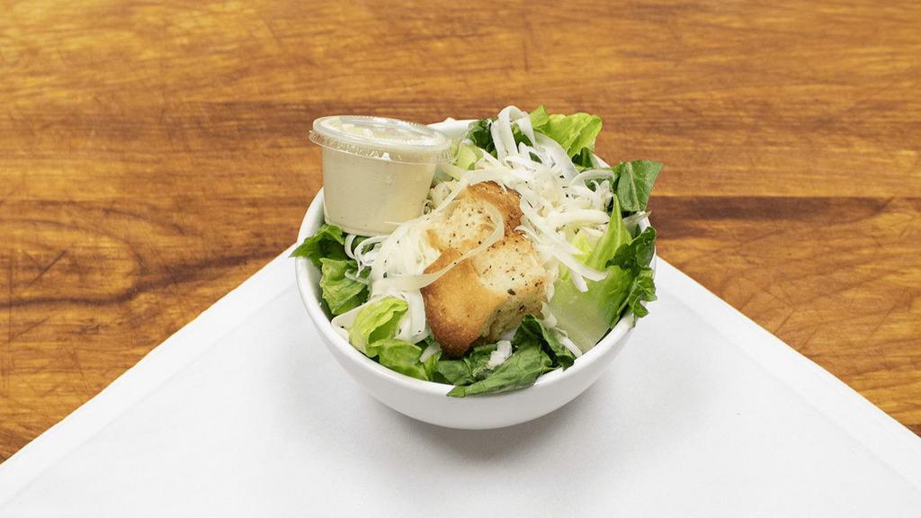 Caesar Salad · Romaine lettuce with croutons and shaved Parmesan and served with Caesar dressing.