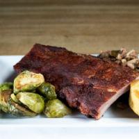 1/2 Slab Baby Back Entree · Slab of Baby Back Ribs served with two sides and Smokehouse cornbread
