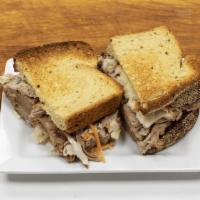 Pulled Pork Sandwich · Pulled pork and coleslaw served on southern style toast with your choice of smokehouse sauce...
