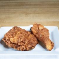 2 Piece Dark Fried Chicken · Chicken thigh and a chicken leg.