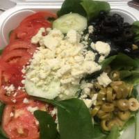 Greek Salad · Romaine lettuce, spinach, cucumber, feta, green and black olives, tomatoes and Greek dressin...