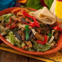 Fajita Taco Salad · Your choice of grilled chicken or steak cooked with bell pepper, onion and tomato in a crisp...