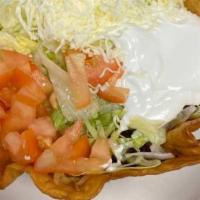 Taco Salad · A crispy flour tortilla shell with choice of ground beef, beef tips of chicken with lettuce,...