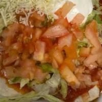 Burritos Deluxe · 2 burritos – 1 chicken & beans and 1 beef & beans – topped with lettuce, tomato and sour cre...