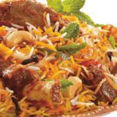 Goat Biryani · Tender pieces of goat, cooked in basmati rice, cashew nuts, golden raisins, and exotic spices.