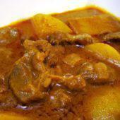 Lamb Vindaloo · Lamb cooked in a tangy sauce with cubed potatoes.