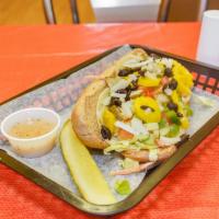 Veggie Sub · Lettuce, tomatoes, onions, black olives, bell peppers, pickles, banana peppers, carrots, cuc...