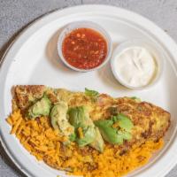 Amigos Omelette · Egg, tomatoes, onion, jalapenos, avocado, and cheddar cheese, topped with pico and sour crea...