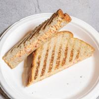 Savi's Grilled Cheese · Grilled Cheddar Cheese on a Sourdough Bread