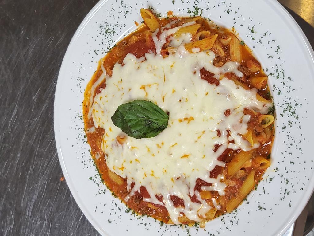 Baked Ziti Pasta · pasta tossed in meat sauce and mozzarella cheese then topped with more mozzarella cheese. Then baked to perfection. Served with salad and bread