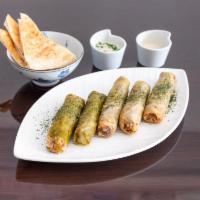 Yabrak Malfouf · Traditional cabbage leaves stuffed with rice and ground beef.