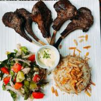 Lamb Ribs Halah · 6 ribs of lamb marinated in an exotic blend and grilled over mesquite.