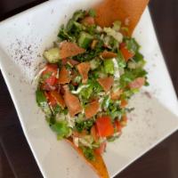 Fattoush Salad · Chopped lettuce, parsley, tomatoes, cucumber, onion, green pepper. Dressed with sumac and pi...