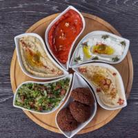Faraon Vegetarian Plate · A combination of 4 dips, 3 falafel, and tabbouli salad.