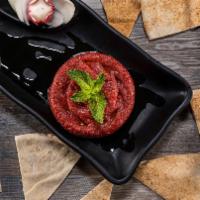 Kibbe Nayeh · Raw meat blended with cracked wheat, onions, and ground red pepper.