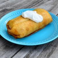 Chimichanga · Filled with rice, beans, cheese and your choice chicken or ground beef.