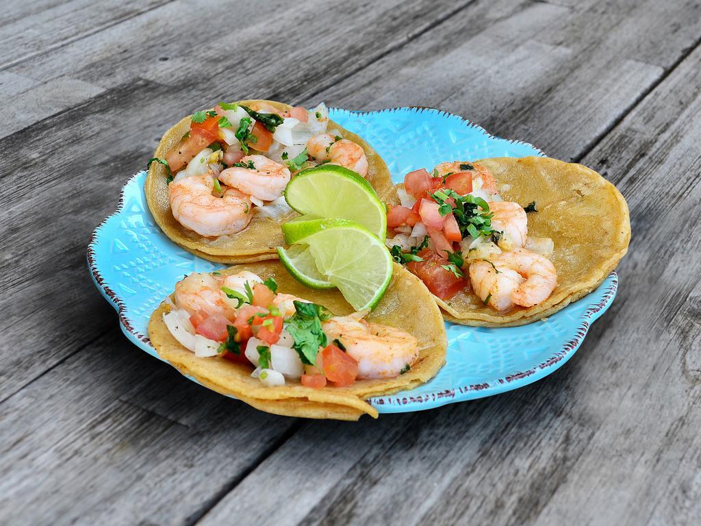 3 Tequila-Lime Shrimp Tacos · Grilled shrimp cooked with seasonings, lime and tequila topped with tomatoes, onions and cilantro.