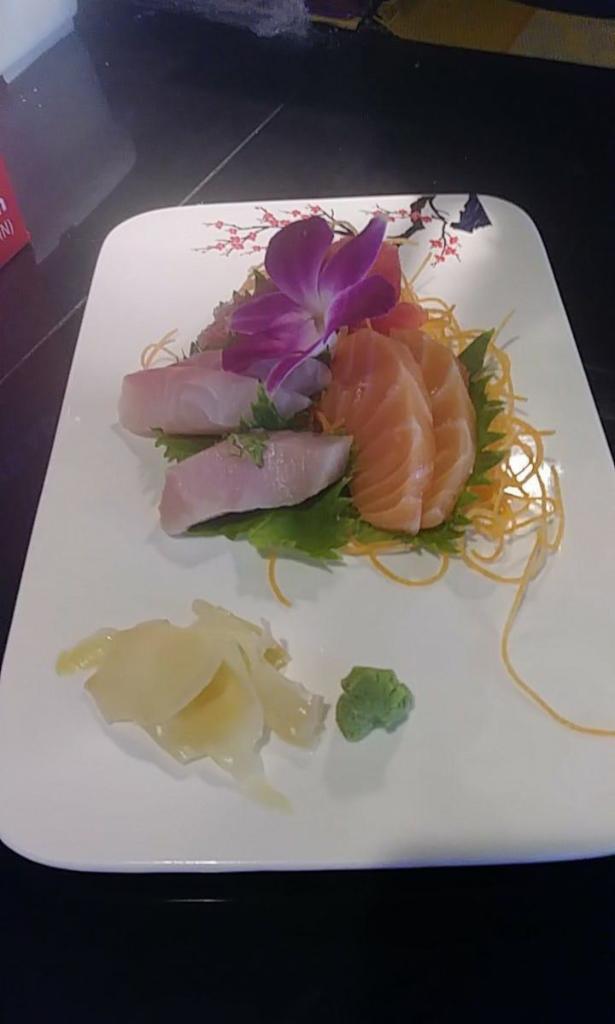J15. Sashimi Appetizer · Chef choice 7 pieces of sashimi.