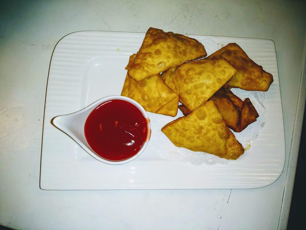 J32. Crab Rangoon (6) · Imitation crab meat with cream cheese and celery wrapped in wonton skin.