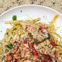 Wild Lobster Fettuccine Alfredo  · Fettuccine Alfredo premium Lobster meat smothered in our famous creamy butter parmesan mozza...