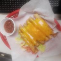 Taquitos · 6 shredded beef or chicken taquitos topped with shredded Cheddar cheese. Served with salsa.