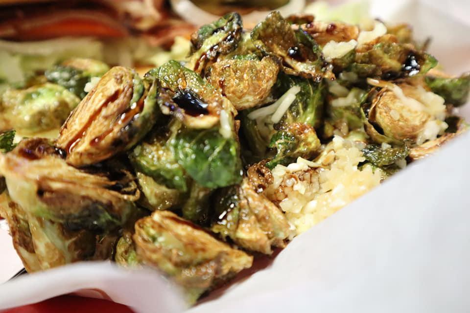 Brussels Sprout · Brussels sprout fried with chunks of bacon, minced garlic, Parmesan and drizzled with balsamic vinaigrette.