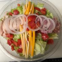 Chef Salad · Fresh greens, turkey, ham, cheddar and Swiss cheese, tomatoes, onions and croutons