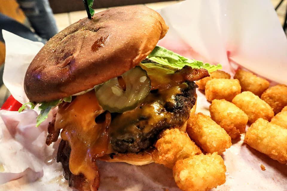 Bacon and Cheddar Cheese Burger · Smoked bacon and slice of cheddar cheese. 1/2 lb Angus patty, served with lettuce, tomatoes, onions and pickle.