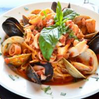 Calamari Marinara · Clams and mussels. Served over linguine, and with a side house salad.