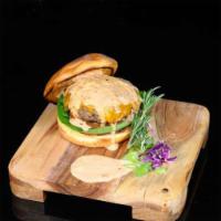DNF Signature Burger · Handmade burger seasoned and topped with our DNF sauce. 
Ready to serve with your choice top...