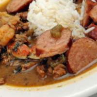 Mardi Gras Gumbo · Thick stew with chicken, sausage, shrimp, okra, and vegetables. Served with rice.
