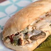 Chicken Philly Cheesesteak Sandwich · Chicken sauteed with mushrooms and onions, green bell pepper with provolone cheese.