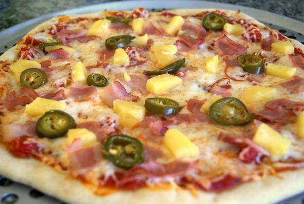 Spicy Hawaiian Pizza · Bacon, pineapple, jalapeno and extra mozzarella cheese with our classic pizza sauce.