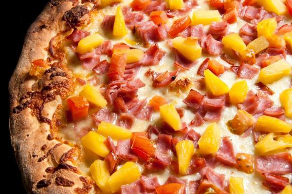 Hawaiian Pizza · Pineapple, ham, extra mozzarella cheese with our classic pizza sauce.