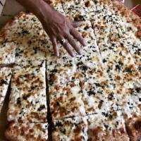 White Pizza · Fresh garlic, feta cheese, basil with olive oil sauce and mozzarella cheese.