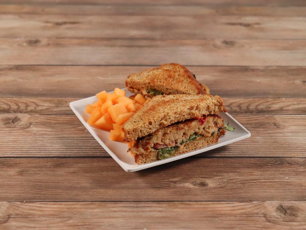 Red Lake Walleye Cake Melt · Walleye mixed with vegetables, herbs, lettuce, tomato, roasted red pepper aioli and cheese blend.
