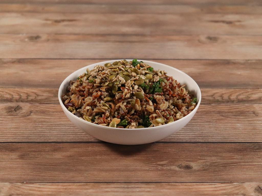 Wild Rice Bowl · Hand harvested wild rice, quinoa, mushrooms, garlic, diced red onion and kale. Served with candied seeds on the side. Vegetarian.