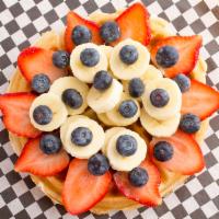 Protein Waffle · Choice of protein, topped with strawberry, blueberries, banana and agave.
