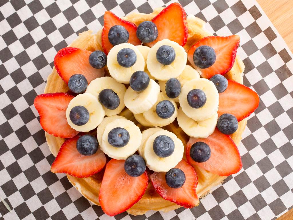Protein Waffle · Choice of protein, topped with strawberry, blueberries, banana and agave.