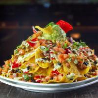Vegan Nachos · Feeds two to three. Included toppings: beyond beef® crumbles, daiya mozzarella cheese, black...