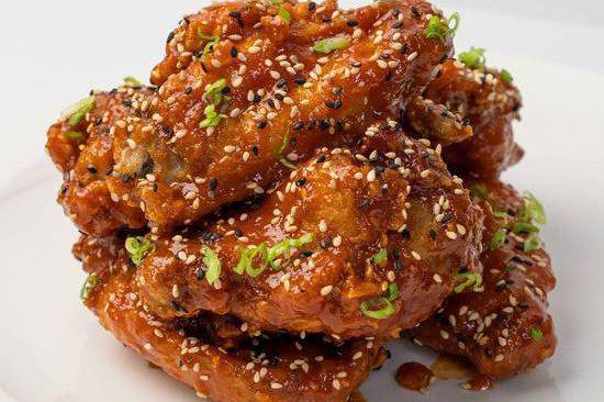 Korean fried chicken wings · Double fried party wings tossed in wildflower honey and spicy gochujang. 