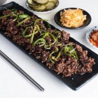 Bulgogi KBBQ plate · Thinly sliced ribeye steak marinated in soy, ginger, honey, and sesame. Served with rice, ki...
