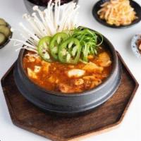 Soon Dubu-jjige · Spicy silken tofu soup with tender bits of pork belly, enoki mushrooms and scallions. 