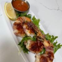 Scampi Pancetta · Grilled prawns wrapped with Italian bacon.