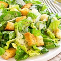 Cesare Salad · Romaine lettuce, croutons, Parmesan cheese, and anchovies dressing.