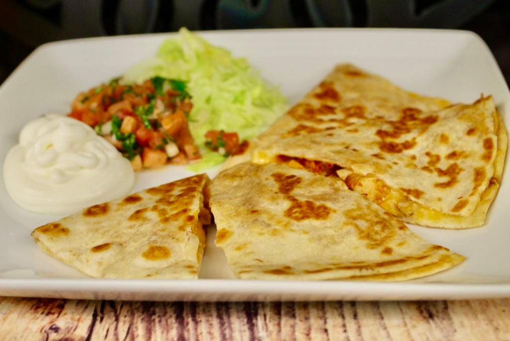 Quesadilla · Flour tortilla, cheese, choice of meat. Served with sour cream, pico de gallo, and house salsa (choice).