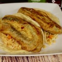 Chile-Relleno Combo · 2 jalapeno peppers stuffed with cheese, egg white fried served on a corn tortilla with Spani...